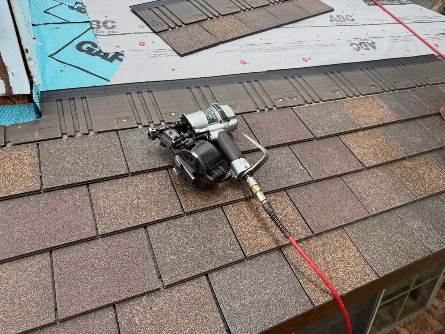 Close-up of F-Wave XTM shingles being installed.