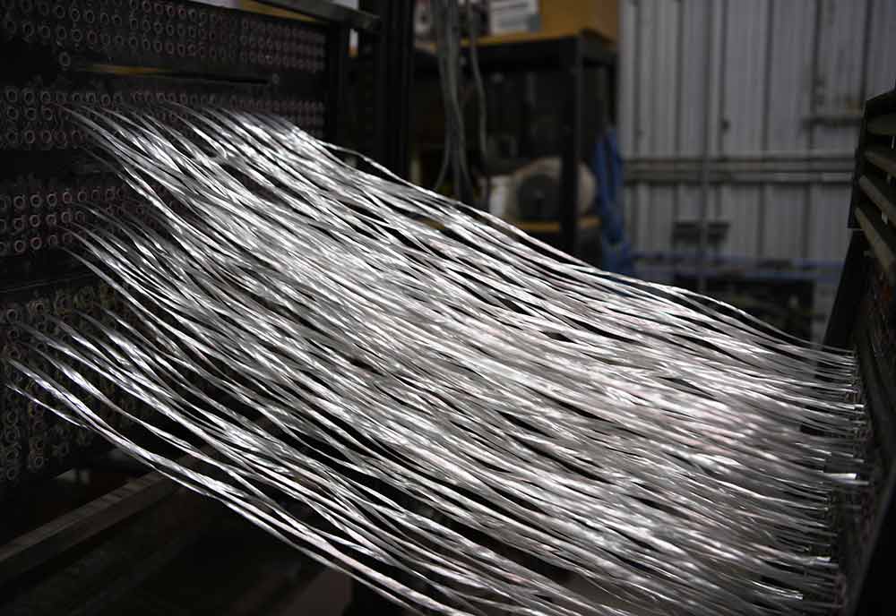 Close-up of fiberglass pultrusion process.